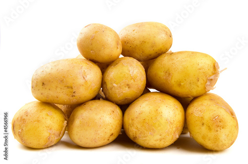 Pile of potatoes on white background isolated