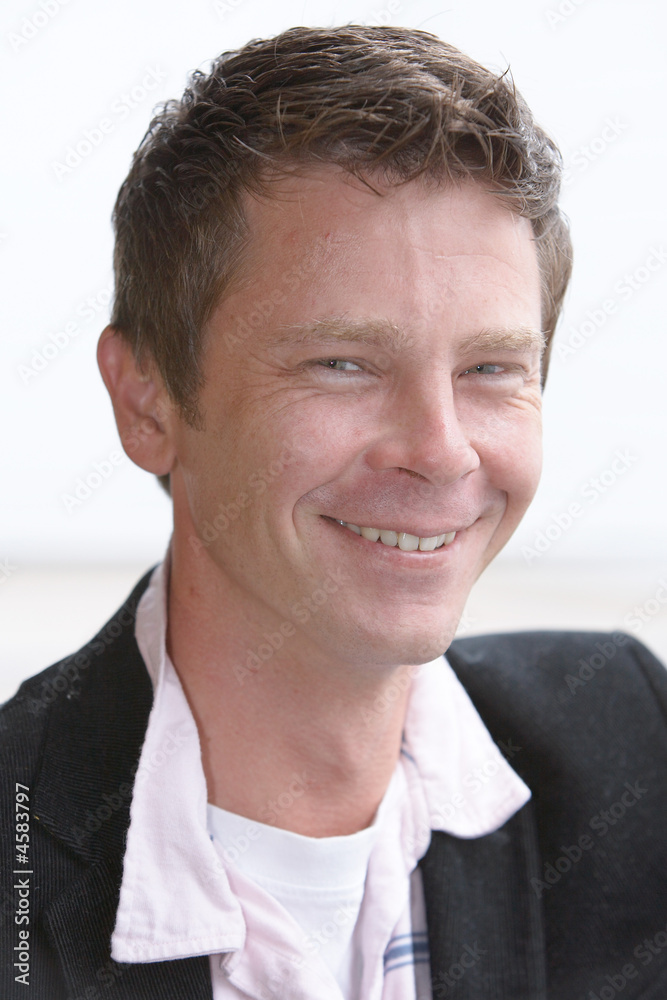 Man in thirties smiles