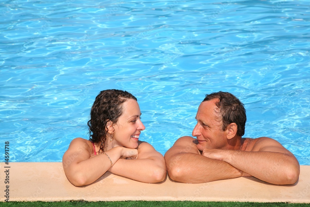 Woman and man at the pool board 