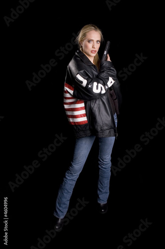 Woman in leather USA jacket with a gun photo