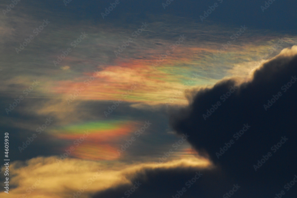 Rainbow clouds and blue skies