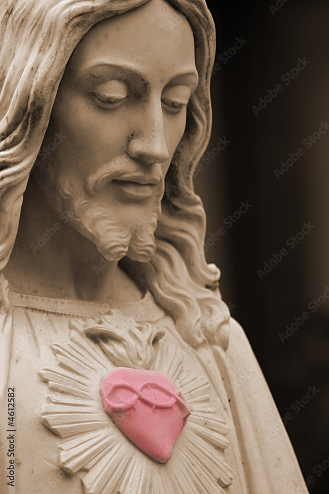 Naklejka premium Jesus with a red heart selective color
