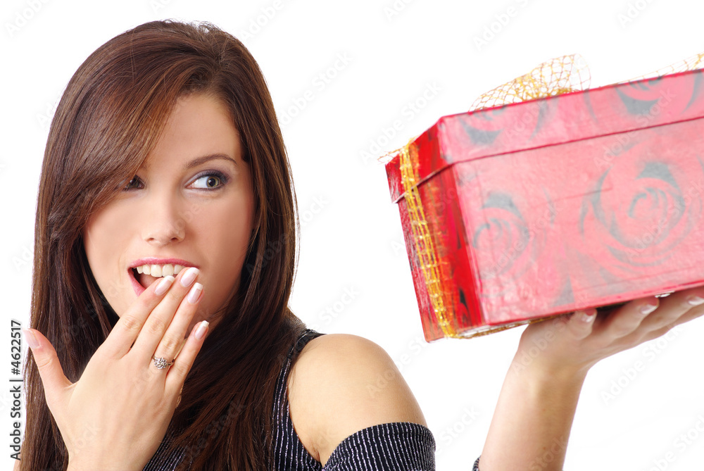 Beautiful young woman holding boxed gift on white background Beautiful young woman holding boxed gift on white background