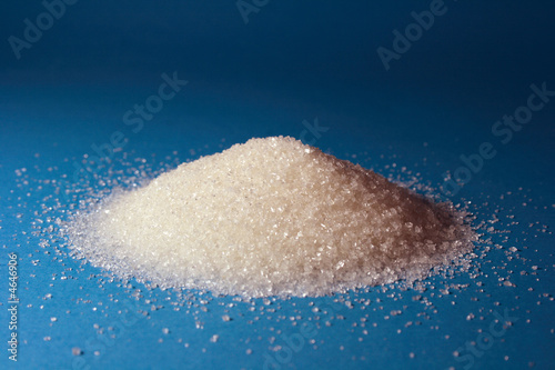 Heap of sugar and a spoon