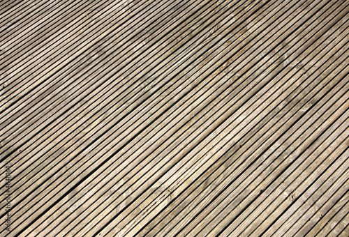 Grooved wooden garden decking close up.