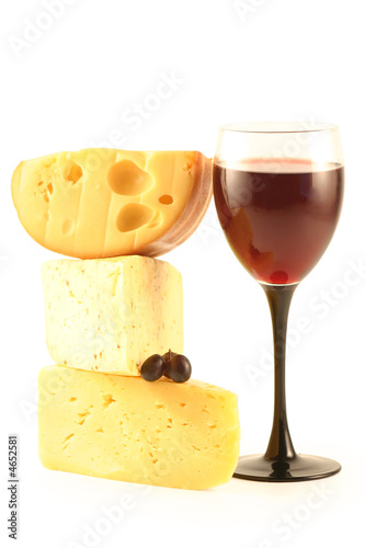 Grapes, cheese and a glass with red wine isolated on white.