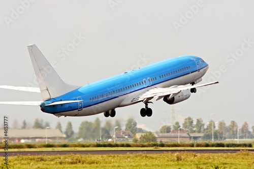 Airplane taking off from Schiphol airport in the Netherlands photo