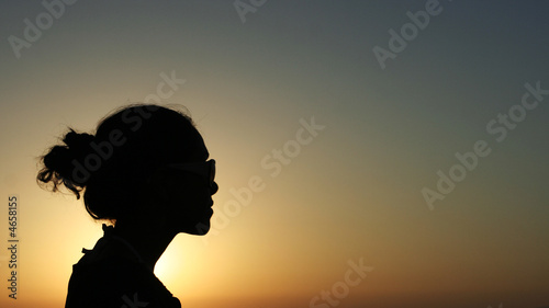 Silhouette of a girl in sunset