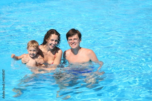 family in the swimming pool