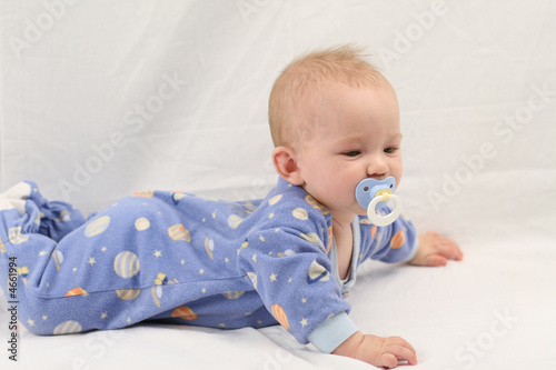 Baby in jammies on white backdrop
