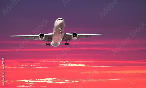 Large jet arriving at sunset