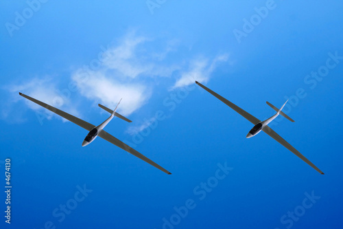 A gliders shot from below against a blue sky