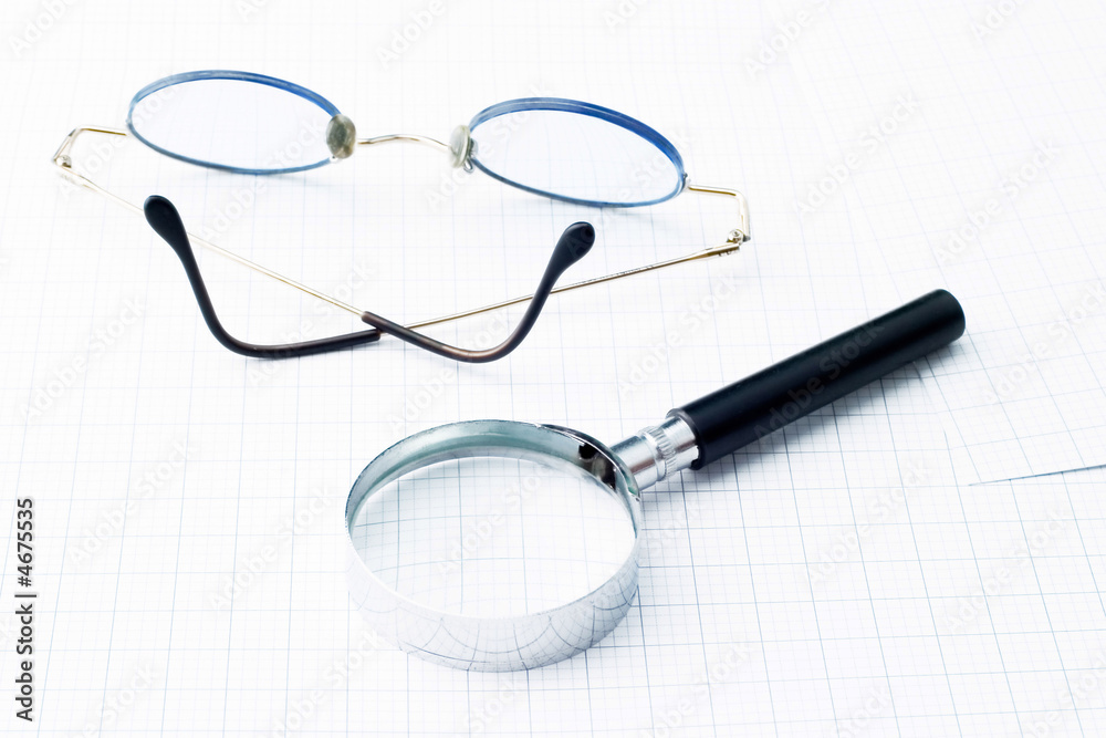 Fototapeta premium Glasses and magnifying glass