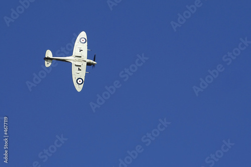 Canvas Print Spitfire against deep blue sky