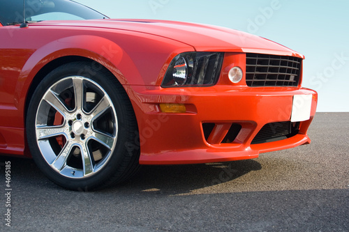 Front of red American muscle car with chrome wheels © Christopher Dodge