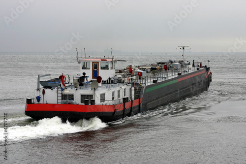 Barge on open sea Fototapeta
