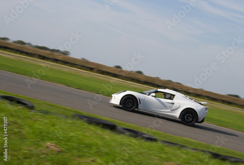 White sports car racing on track