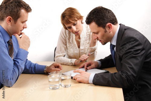 three business people talking about contract