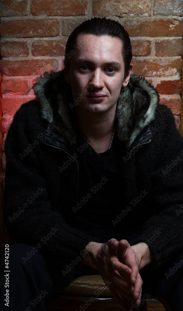 Fototapeta premium Portrait of a young gangster