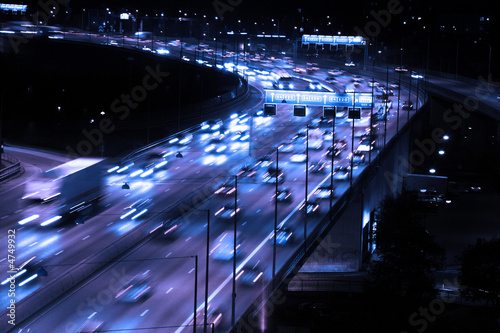 cars at night with motion blur photo