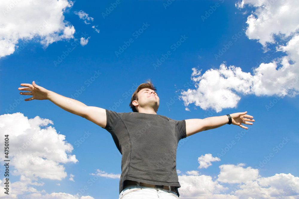 Happy young man relaxing on nature