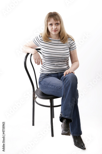 woman sitting on a chair isolated on white