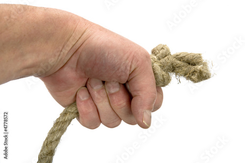 Hand keeps rope with node