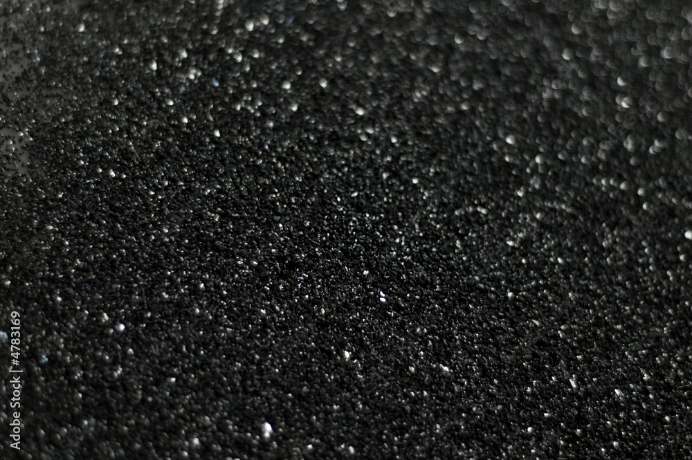 grey black plastic grain material close up