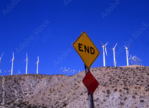 windmills for electricity and traffic sign END photo