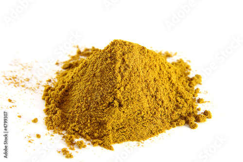  pile of curry powder on white background