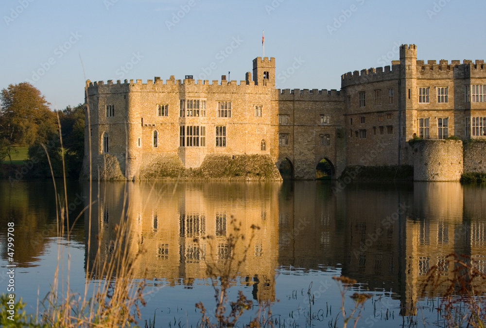 English castle and moat at sunset