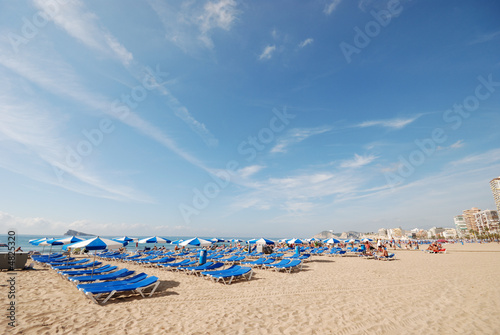 Sunlounger on the Mediterranean beach in Benidorm, Spain