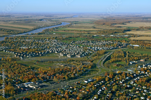 Aerial view of suburban neighborhood near highway