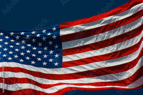 American flag and blue sky photo