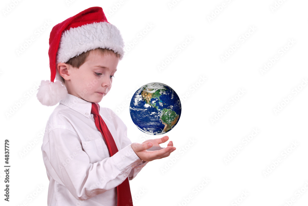 Fototapeta premium Boy in Christmas hat with earth