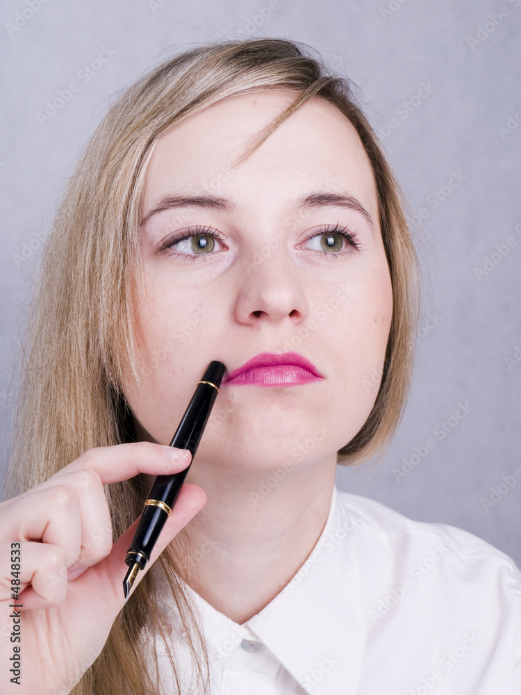 Portrait of thoughtful women holding the pen Portrait of thoughtful women holding the pen