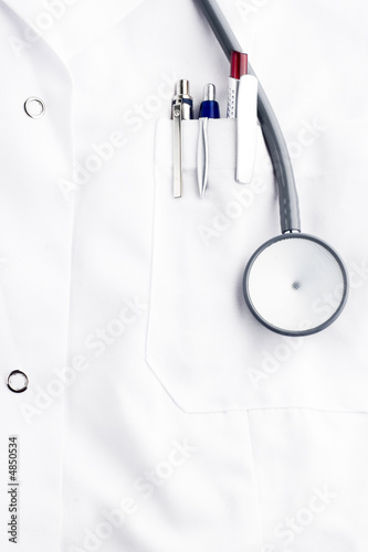 stethoscope and ballpoins on doctor's lab coat