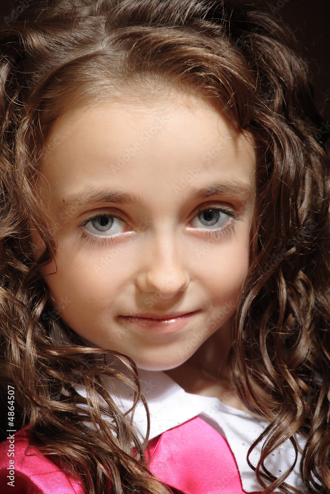 Portrait of curly-haired girl wearing bright pink clothing Portrait of curly-haired girl wearing bright pink clothing