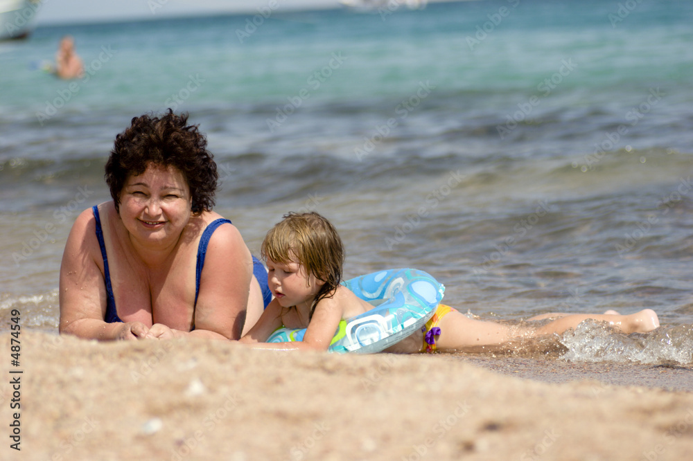 Grandmother and grandchild on the beach Grandmother and grandchild on the beach