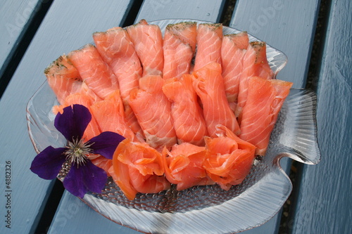 Salmon with dill and  Jackmannii flower photo