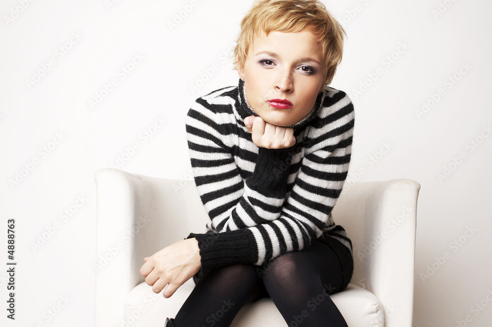 Nice blondgirl on the chair looking into eyes Nice blondgirl on the chair looking into eyes