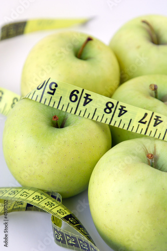 Isolated apples fruit & measuring tape