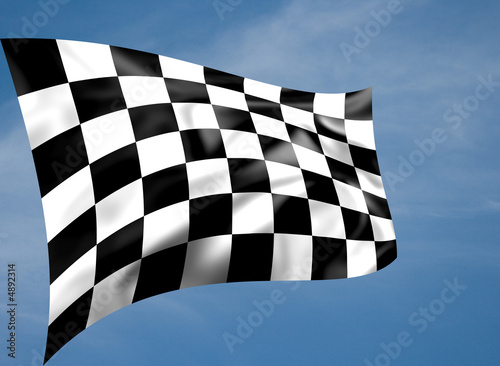 Rippled black and white chequered flag with sky background