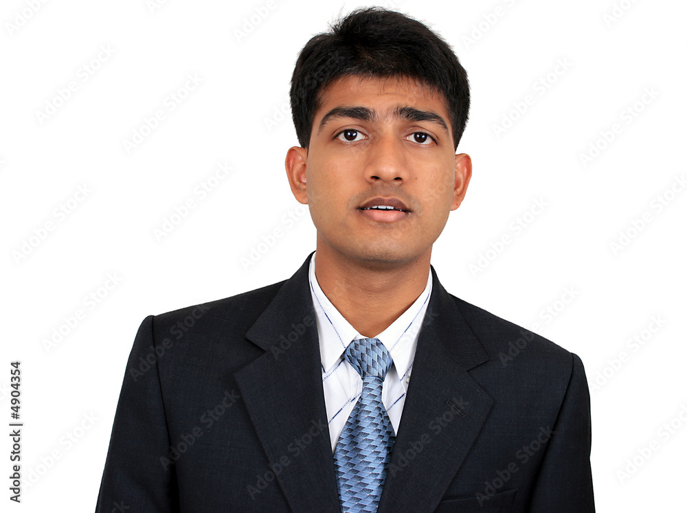 Young Indian business man in puzzled pose Young Indian business man in puzzled pose