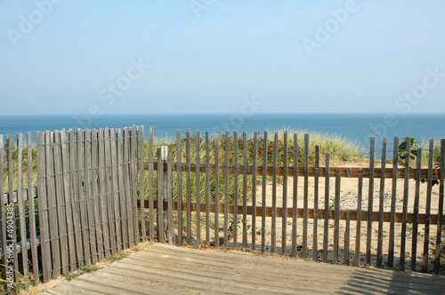 Fototapeta Naklejka Na Ścianę i Meble -  View of Atlantic Ocean Through Fence