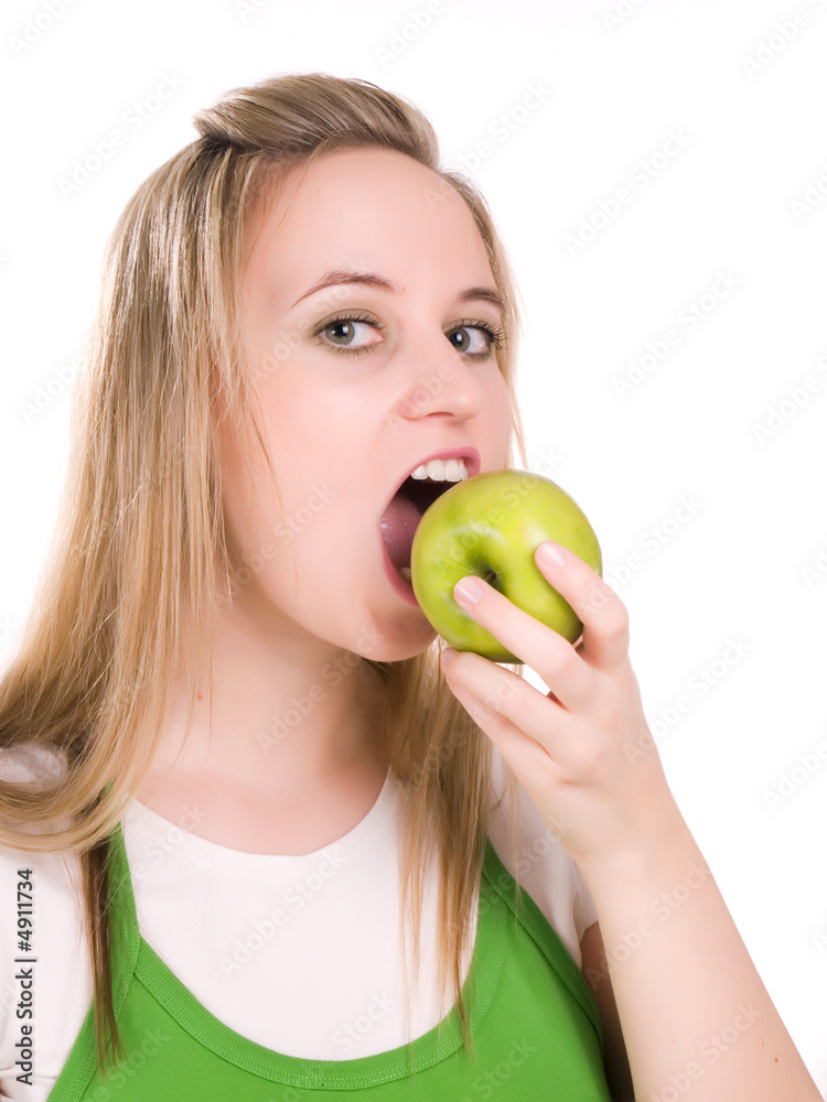 Beautiful young woman eating green apple. Isolated over white Beautiful young woman eating green apple. Isolated over white