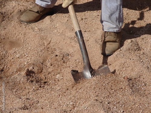 Photography shoveling sand