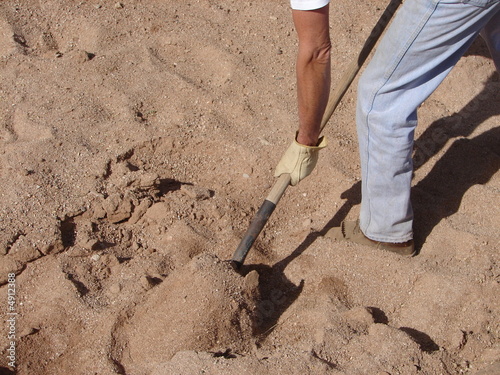 shoveling sand