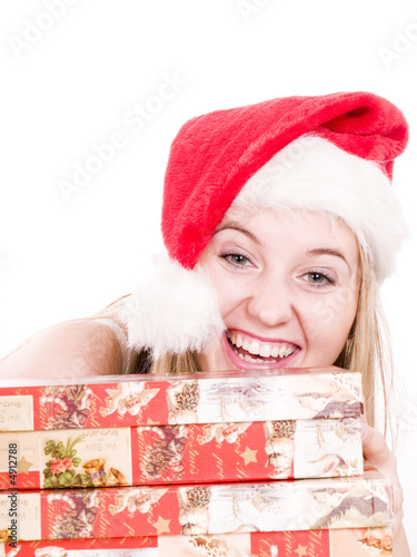 Smilling young woman and christmas boxes.