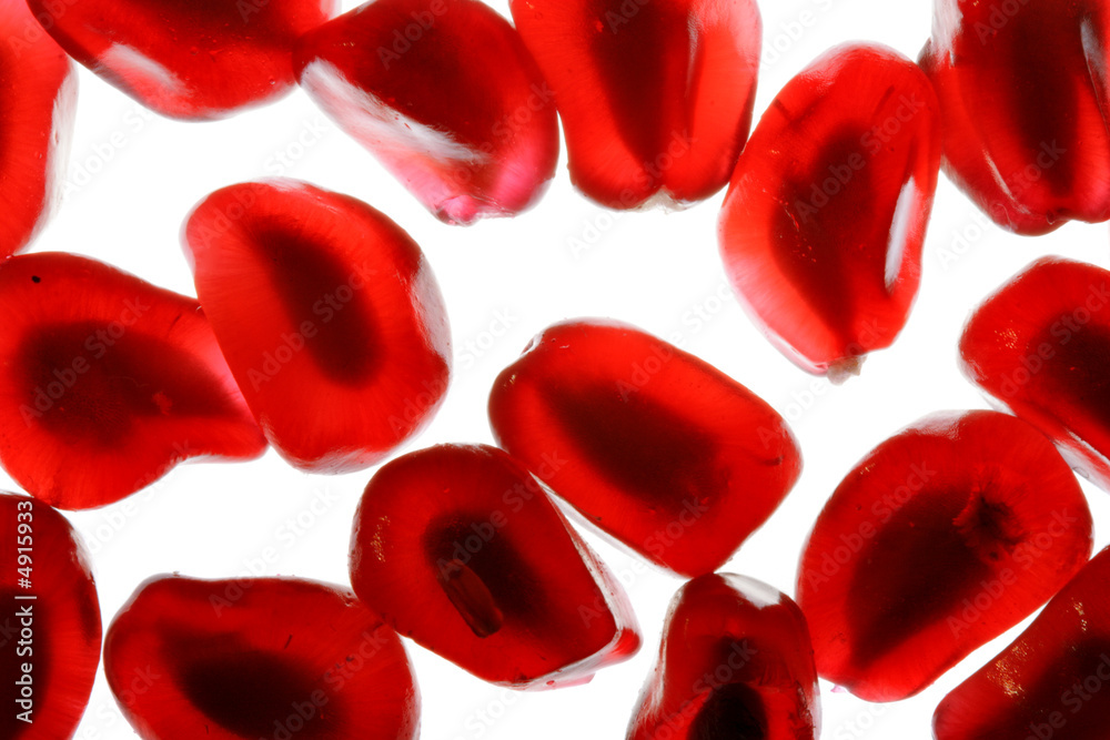 Grains of pomegranate macro isolated Grains of pomegranate macro isolated